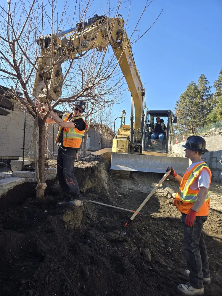 sweet yards landscapers leveling out the ground