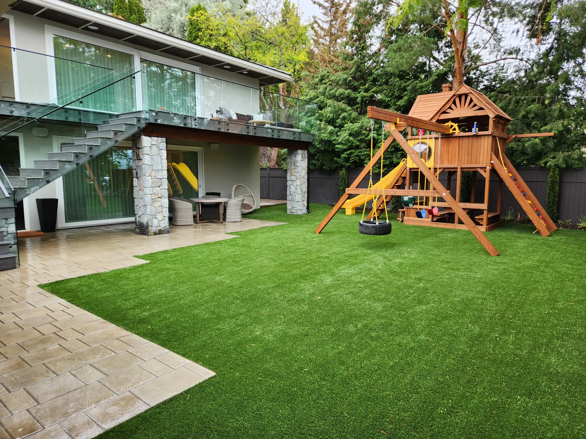 Lake front property with pool and beautiful yard done by sweet yards in Kelowna