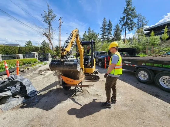 Sweet yards landscapers doing construction work